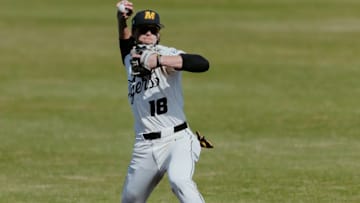 Missouri shortstop Jackson Lovich throws a baseball to first. 