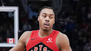 Toronto Raptors forward Scottie Barnes celebrates a play with guard Jamal Shead.