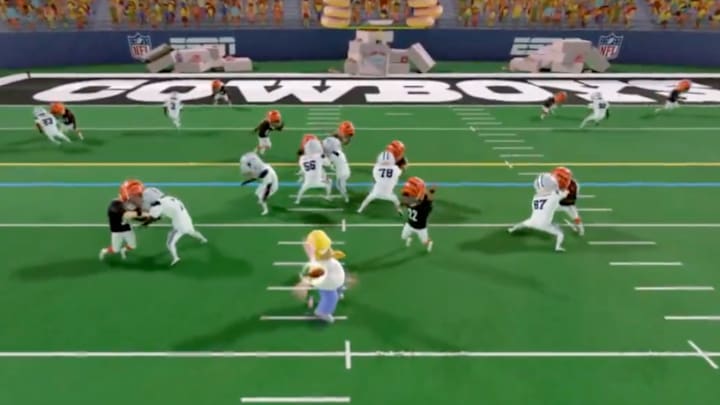 Homer Simpsons throws a touchdown pass to Dallas Cowboys wide receiver CeeDee Lamb on the Simpsons alt cast.