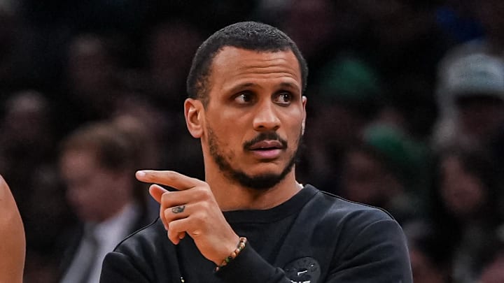 Apr 7, 2026; Boston, Massachusetts, USA; Boston Celtics head coach Joe Mazzulla with guard Derrick White (9) from the sideline as they take on the Charlotte Hornets at TD Garden. Mandatory Credit: David Butler II-Imagn Images