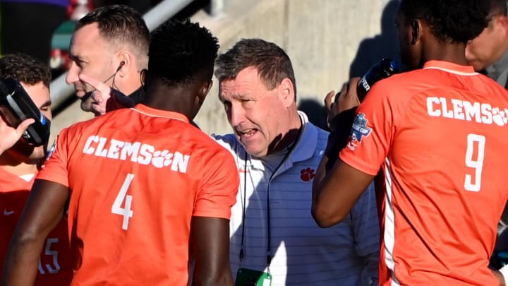 Dec 12, 2021; Cary, NC, USA;  Clemson head coach Mike Noonan talks to defender Justin Malou (4) and forward Mohamed Seye (9) in the second half at WakeMed Soccer Park. Clemson defeated Washington 2-0. 