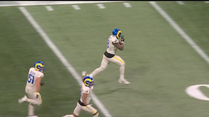 Los Angeles Rams linebacker taunts the Atlanta Falcons sideline while returning a blocked field goal for a touchdown.