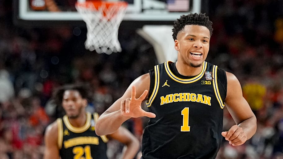Michigan Wolverines guard Trey McKenney gestures after a play against the Arizona Wildcats in the Final Four.
