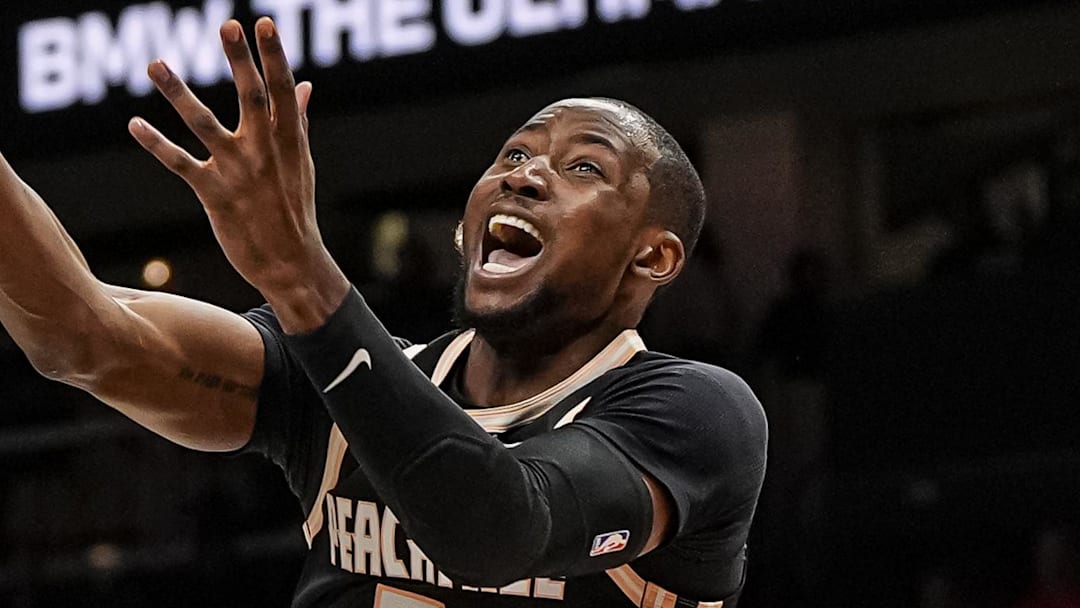 Mar 16, 2026; Atlanta, Georgia, USA; Atlanta Hawks forward Jonathan Kuminga (0) is called for an offensive foul on Orlando Magic guard Jalen Suggs (4) during the second half at State Farm Arena. Mandatory Credit: Dale Zanine-Imagn Images
