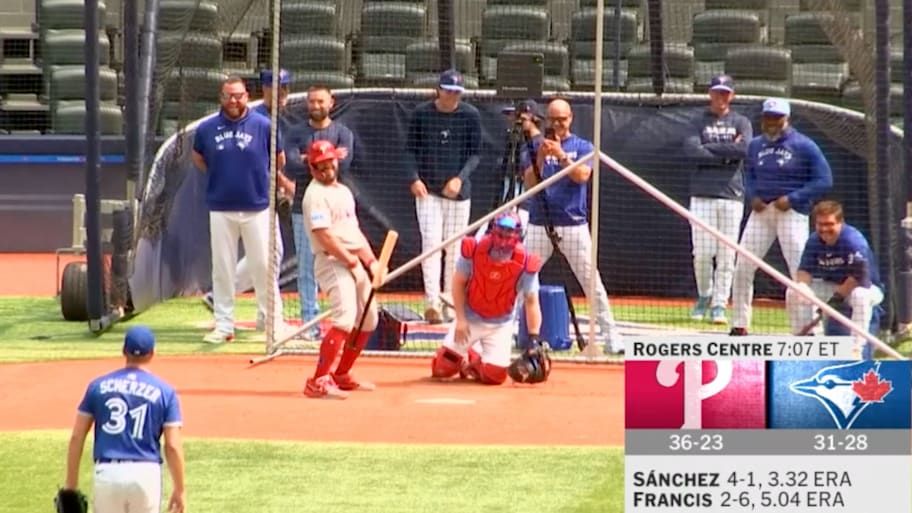 Kyle Schwarber pulls a fast one on Max Scherzer before a game between the Phillies and Blue Jays. | MLB.com