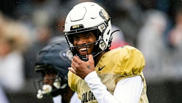 Colorado's Shedeur Sanders smiles before taking a snap during a Colorado football spring game at Folsom Field in Boulder, Colo., on Saturday, April 27, 2024.