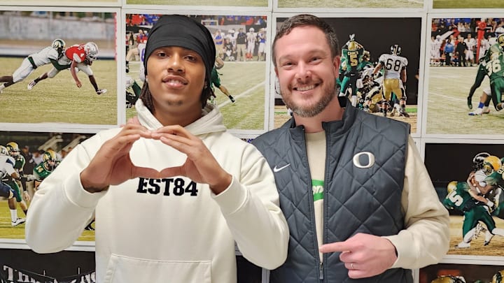 Five-star linebacker Tyler Atkinson with Oregon coach Dan Lanning