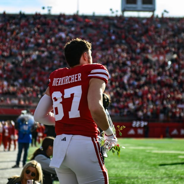 Nate Boerkircher runs out of the tunnel during his senior day introduction. 