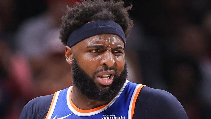 Apr 30, 2026; Atlanta, Georgia, USA; New York Knicks center Mitchell Robinson (23) is restrained by assistant coach Rick Brunson against the Atlanta Hawks in the second quarter during game six of the first round of the 2026 NBA Playoffs at State Farm Arena. Mandatory Credit: Brett Davis-Imagn Images