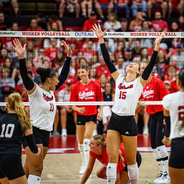 Teraya Sigler (11) and Andi Jackson (15) celebrate getting the game to match point. 