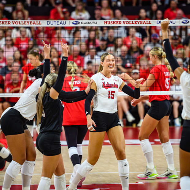 The Huskers celebrate a kill from Andi Jackson (15). 