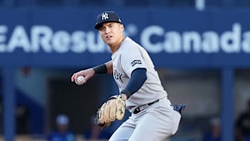 Oct 4, 2025; Toronto, Ontario, CAN; New York Yankees shortstop Anthony Volpe (11) throws to first for an out in the fifth inning against the Toronto Blue Jays during game one of the ALDS round for the 2025 MLB playoffs at Rogers Centre. Mandatory Credit: Nick Turchiaro-Imagn Images