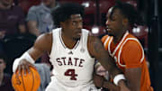 Mississippi State Bulldogs forward Cameron Matthews (4) dribbles as Texas Longhorns forward Arthur Kaluma (6) defends during the first half at FedExForum.