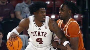 Mississippi State Bulldogs forward Cameron Matthews (4) dribbles as Texas Longhorns forward Arthur Kaluma (6) defends during the first half at FedExForum.