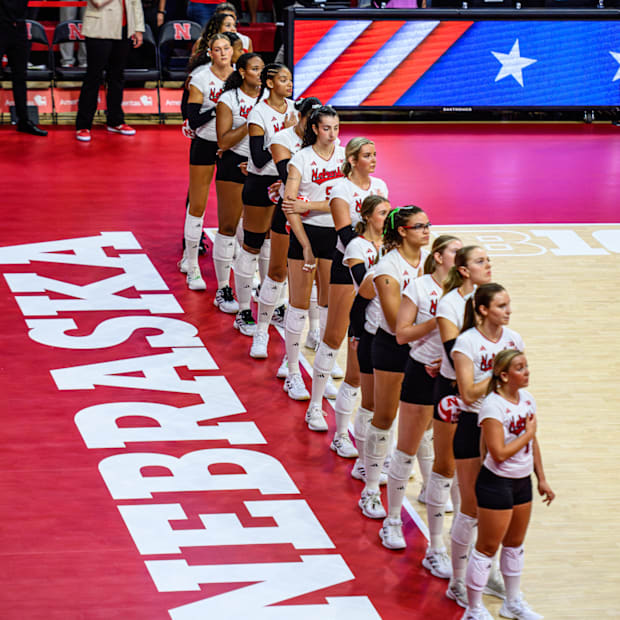 The Huskers stand for the National Anthem prior to their match against Washington. 