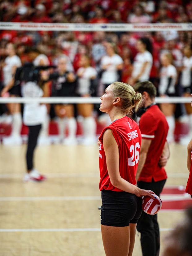 Lauren Stivrins stands for the National Anthem. 