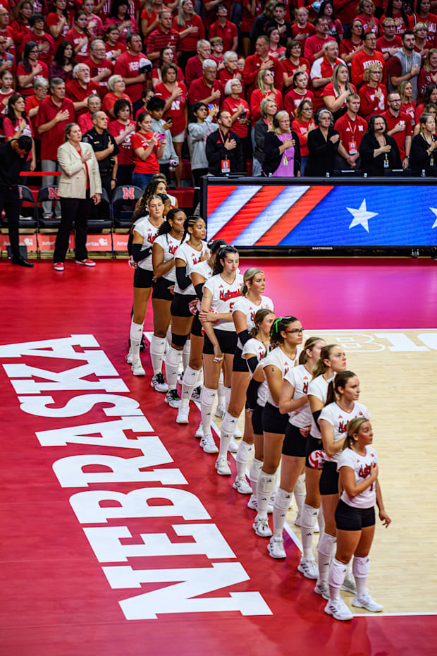 The Huskers stand for the National Anthem prior to their match against Washington. 