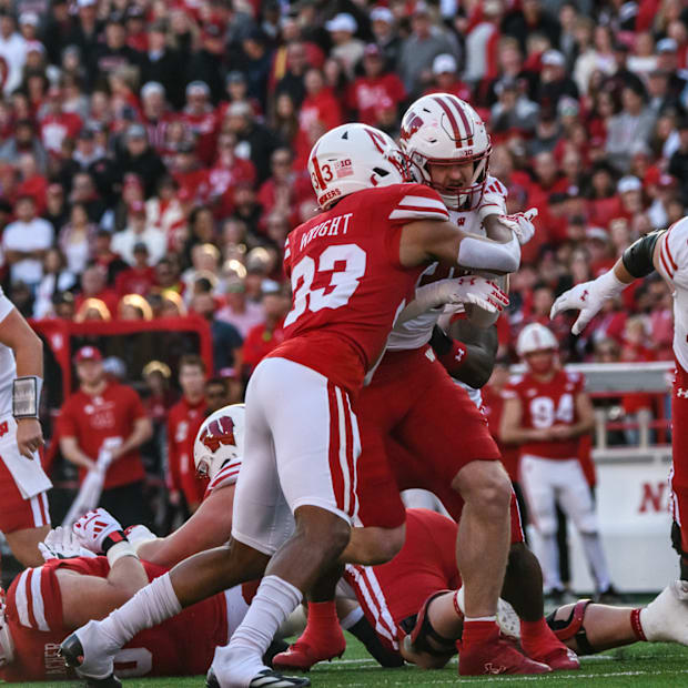 Javin Wright (33) makes a tackle on a Wisconsin runner. 