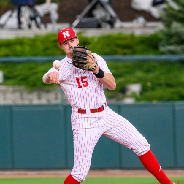 Dylan Carey throws to first base for an out. 