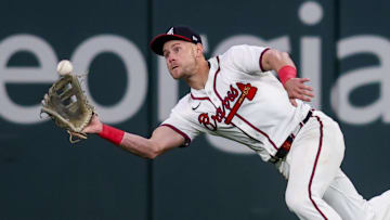Apr 8, 2025; Atlanta, Georgia, USA; Atlanta Braves right fielder Jarred Kelenic (24) catches a fly ball against the Philadelphia Phillies in the ninth inning at Truist Park. Mandatory Credit: Brett Davis-Imagn Images
