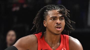 Toronto Raptors guard Jamal Shead passes the ball away from Los Angeles Lakers guard Nick Smith Jr.
