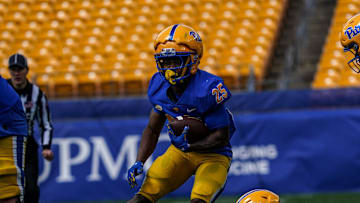 Desmond Reid cuts back against the Pitt defense during the Blue-Gold Game. 