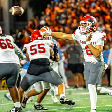 Edgewater quarterback Carter Emanuel (2) completed 13 of 14 passes for 177 yards and one touchdown and rushed four times for 14 yards and a score to help the unbeaten Eagles (10-0) soar past Boone, 28-7, and win the “Battle of the Barrel.” Edgewater will host a playoff game on Nov. 7.