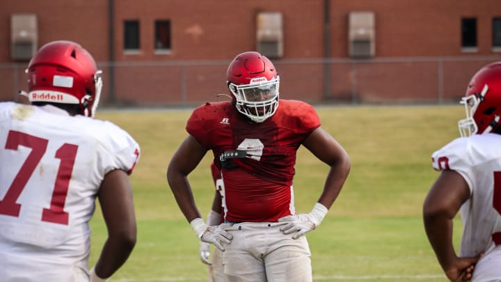 Georgia commit Isaiah Gibson gets ready to take a snap at Warner Robbins practice. 