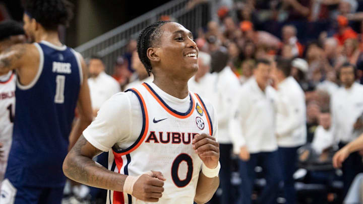Auburn Tigers guard Tahaad Pettiford (0) celebrates the win as Auburn Tigers take on Nevada Wolfpack during the third round of the National Invitation Tournament at Neville Arena in Auburn, Ala. on Wednesday, March 25, 2026. Auburn Tigers defeated Nevada Wolfpack 75-69.