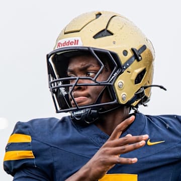 Fort Lauderdale St. Thomas Aquinas quarterback Mason Mallory completed 18 of 23 passes for three touchdowns and ran 10 times for 67 yards and a score to lead the Raiders past Hollywood McArthur, 34-7, in the Class 5A, Region 4 final on Nov. 28, 2025.