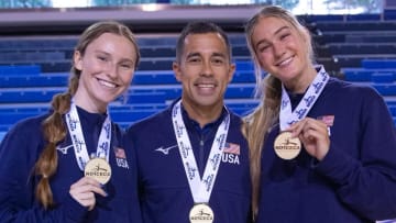 Nebraska volleyball players Bergen Reilly (left) and Andi Jackson (right) and assistant coach Jaylen Reyes (center) pose with their gold medals after winning the NORCECA U21 Continental Championship in Toronto.