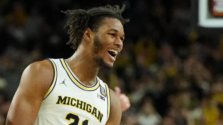 Apr 6, 2026; Indianapolis, IN, USA; Michigan Wolverines forward Morez Johnson Jr. (21) and guard Nimari Burnett (4) celebrate after their win against the UConn Huskies in the national championship of the Final Four of the men's 2026 NCAA Tournament between the  and the Michigan Wolverines at Lucas Oil Stadium. Mandatory Credit: Bob Donnan-Imagn Images