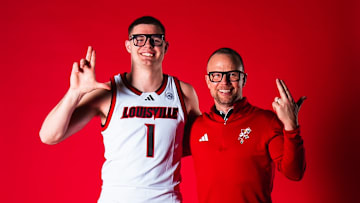Former Virginia guard Isaac McKneely and Louisville head coach Pat Kelsey