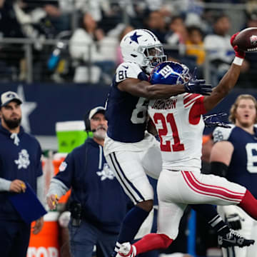 Nov 28, 2024; Arlington, Texas, USA; New York Giants cornerback Adoree' Jackson (21) breaks up a pass intended for Dallas Cowboys wide receiver Jonathan Mingo (81) during the first half at AT&T Stadium. 