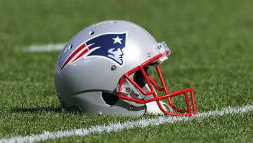 Oct 2, 2022; Green Bay, Wisconsin, USA;  A New England Patriots helmet sits on the field during warmups prior to the game against the Green Bay Packers at Lambeau Field. Mandatory Credit: Jeff Hanisch-USA TODAY Sports