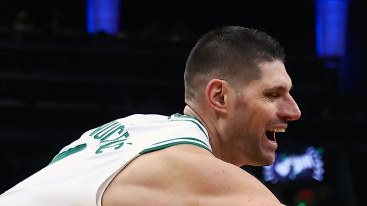 Feb 11, 2026; Boston, Massachusetts, USA; Chicago Bulls Rob Dillingham (7) goes past Boston Celtics center Nikola Vucevic (4) during the second half at TD Garden. Mandatory Credit: Winslow Townson-Imagn Images