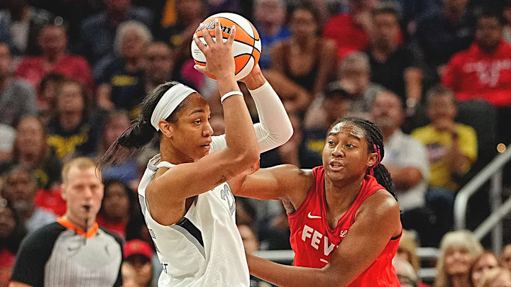 Wilson (left) and the Aces are battling for playoff positioning as the WNBA regular season comes to a close.