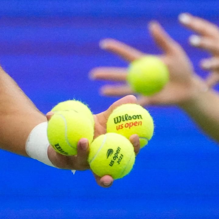A detail view as Carlos Alcaraz of Spain picks a ball to serve to Matteo Arnaldi of Italy on day eight of the U.S. Open 
