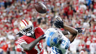 49ers wide receiver Brandon Aiyuk catches the ball over Lions cornerback Kindle Vildor in the third