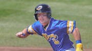 RubberDucks baserunner Travis Bazzana takes off for third base against the Altoona Curve on April 13, 2025, in Akron, Ohio.