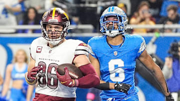 Washington Commanders tight end Zach Ertz (86) scores a touchdown against Detroit Lions safety Ifeatu Melifonwu (6) during the first half of the NFC divisional round at Ford Field in Detroit on Saturday, Jan. 18, 2025.