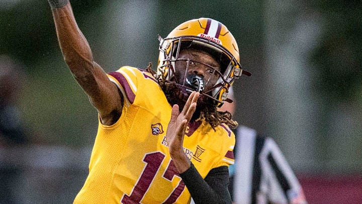 Glades Central quarterback Taj Barnes throws the ball against Pahokee during the Muck Bowl on November 1, 2024, in Belle Glade, Florida.