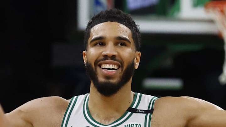 Oct 27, 2023; Boston, Massachusetts, USA; Boston Celtics forward Jayson Tatum (0) smiles as he heads for the bench after a three point basket against the Miami Heat during the fourth quarter at TD Garden. Mandatory Credit: Winslow Townson-Imagn Images