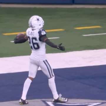Cowboys cornerback Daron Bland celebrates after recording a pick six vs. the Commanders.