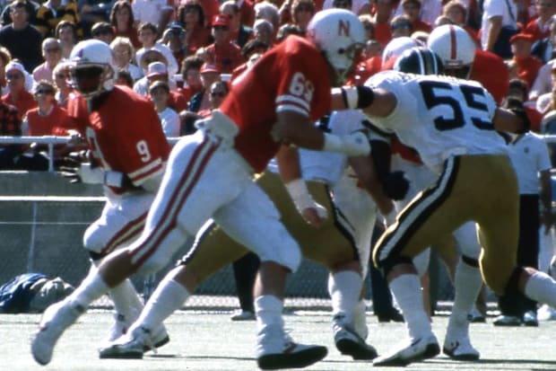 Tom Welter blocks in front of quarterback Steve Taylor.