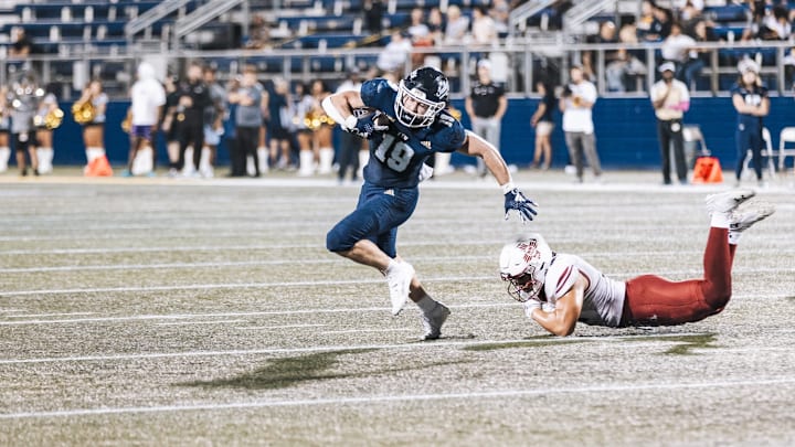 Wide receiver Ross Fournet breaks a tackle Wide receiver Ross Fournet breaks a tackle