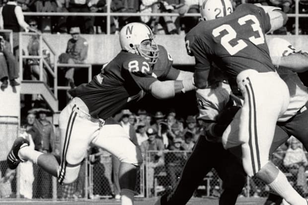 Steve Manstedt (82) joins other Huskers in tackling a Kansas Jayhawk in 1973.