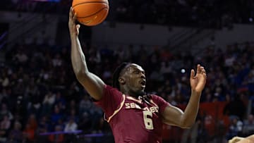 Florida State guard Robert McCray V (6) shoots past Florida forward Thomas Haugh (10) during the first half of an NCAA mens basketball game at Exactec Areana at the Steven C. O Connell Center in Gainesville, FL on Tuesday, November 11, 2025. [Alan Youngblood/Gainesville Sun]