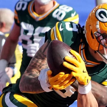 Green Bay Packers wide receiver Christian Watson catches a touchdown pass against New York Giants cornerback Deonte Banks.