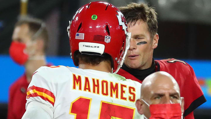 Kansas City Chiefs quarterback Patrick Mahomes shakes hands with Tampa Bay Buccaneers quarterback Tom Brady.